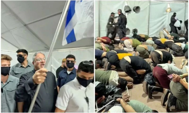 وزير الأمن القومي الإسرائيلي إيتمار بن غفير يلوح بعلم إسرائيل داخل مركز احتجاز لناشطي أسطول غزة