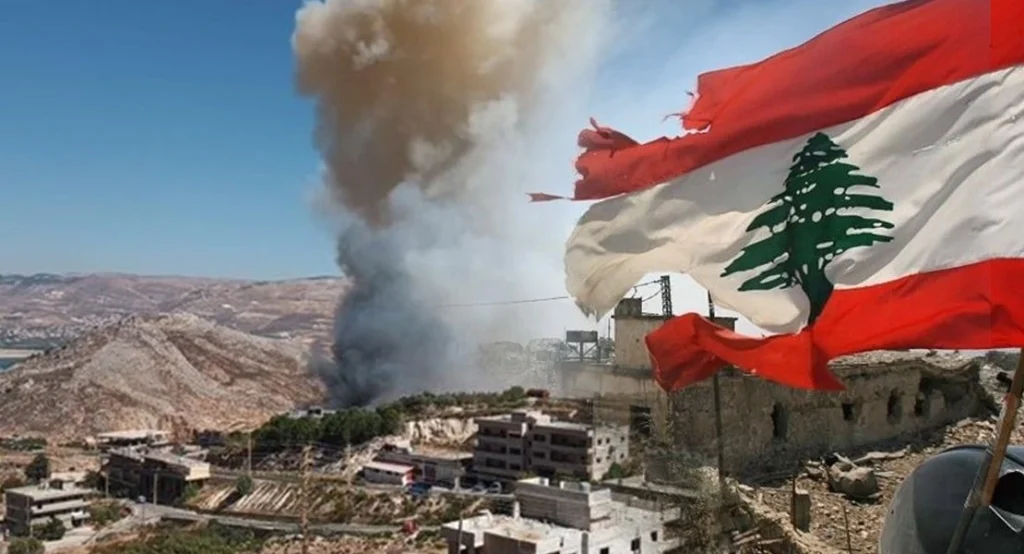 العلم اللبناني وسط آثار الدمار في لبنان Lebanon Conflict Aftermath